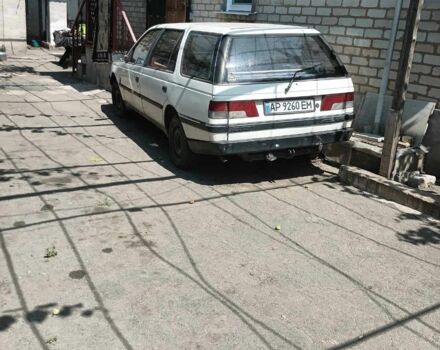 Белый Пежо 405, объемом двигателя 1.6 л и пробегом 400 тыс. км за 400 $, фото 1 на Automoto.ua