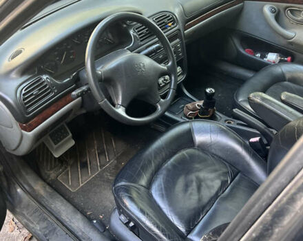 Черный Пежо 406, объемом двигателя 2 л и пробегом 370 тыс. км за 2100 $, фото 6 на Automoto.ua