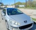 Серый Пежо 407, объемом двигателя 2 л и пробегом 315 тыс. км за 4400 $, фото 1 на Automoto.ua