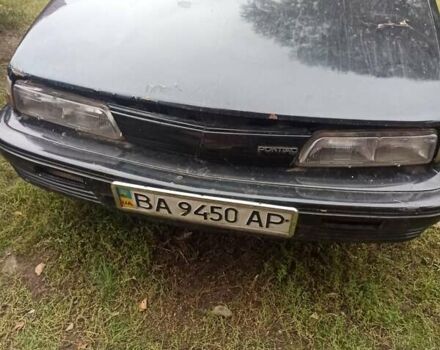 Черный Понтиак Санберд, объемом двигателя 2 л и пробегом 120 тыс. км за 450 $, фото 2 на Automoto.ua