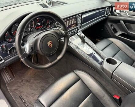 Черный Порше Панамера, объемом двигателя 4.81 л и пробегом 143 тыс. км за 38586 $, фото 1 на Automoto.ua