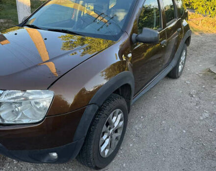 Коричневый Рено Дастер, объемом двигателя 2 л и пробегом 222 тыс. км за 8100 $, фото 1 на Automoto.ua