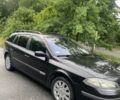 Черный Рено Лагуна, объемом двигателя 1.6 л и пробегом 330 тыс. км за 3711 $, фото 1 на Automoto.ua