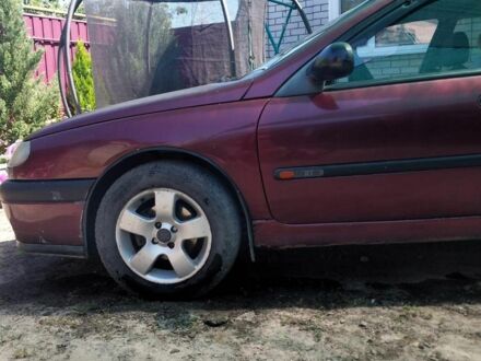 Рено Лагуна 1995 в Синельниковом на Automoto.ua Красный Рено Лагуна, объемом двигателя 2 л и пробегом 250 тыс. км за 1800 $, фото 1 на Automoto.ua