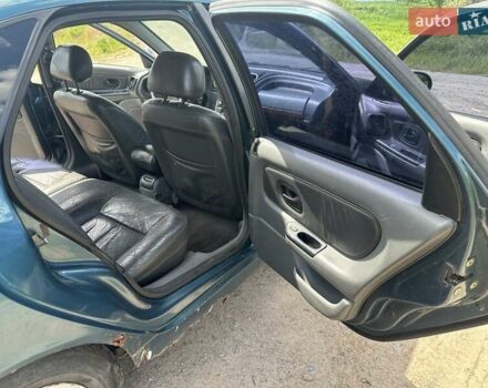 Зелений Рено Лагуна, об'ємом двигуна 2 л та пробігом 226 тис. км за 1750 $, фото 8 на Automoto.ua
