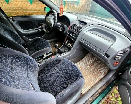 Зеленый Рено Лагуна, объемом двигателя 1.8 л и пробегом 300 тыс. км за 480 $, фото 1 на Automoto.ua