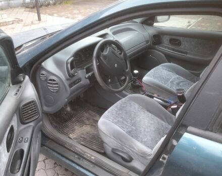 Зеленый Рено Лагуна, объемом двигателя 2 л и пробегом 350 тыс. км за 958 $, фото 1 на Automoto.ua