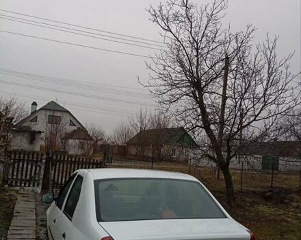 Белый Рено Логан, объемом двигателя 1.6 л и пробегом 160 тыс. км за 4620 $, фото 1 на Automoto.ua