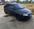 Черный Рено Логан, объемом двигателя 1.4 л и пробегом 228 тыс. км за 3101 $, фото 1 на Automoto.ua