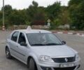 Серый Рено Логан, объемом двигателя 1.4 л и пробегом 301 тыс. км за 3400 $, фото 1 на Automoto.ua
