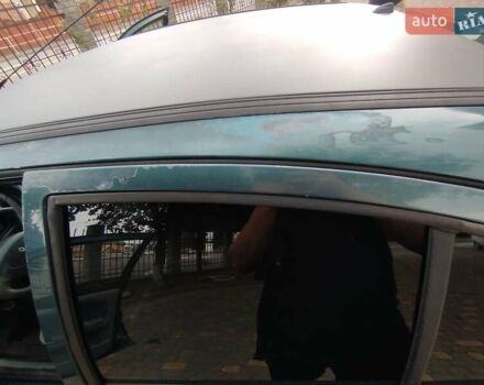 Зелений Рено Меган, об'ємом двигуна 1.6 л та пробігом 403 тис. км за 1950 $, фото 10 на Automoto.ua
