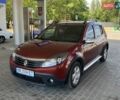 Красный Рено Сандеро СтэпВэй, объемом двигателя 1.6 л и пробегом 180 тыс. км за 7999 $, фото 1 на Automoto.ua