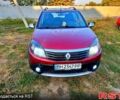 Красный Рено Сандеро, объемом двигателя 1.6 л и пробегом 255 тыс. км за 4400 $, фото 1 на Automoto.ua