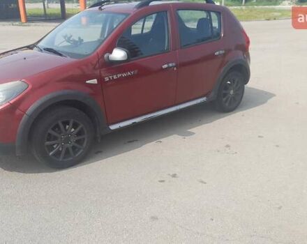 Красный Рено Сандеро, объемом двигателя 1.6 л и пробегом 185 тыс. км за 6200 $, фото 2 на Automoto.ua