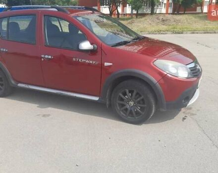 Красный Рено Сандеро, объемом двигателя 1.6 л и пробегом 185 тыс. км за 6200 $, фото 3 на Automoto.ua