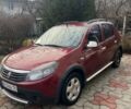 Красный Рено Сандеро, объемом двигателя 1.6 л и пробегом 163 тыс. км за 6300 $, фото 1 на Automoto.ua