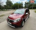 Красный Рено Сандеро, объемом двигателя 1.6 л и пробегом 55 тыс. км за 7000 $, фото 1 на Automoto.ua