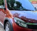 Красный Рено Сандеро, объемом двигателя 1.6 л и пробегом 122 тыс. км за 5981 $, фото 1 на Automoto.ua