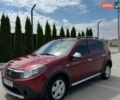 Красный Рено Сандеро, объемом двигателя 1.6 л и пробегом 103 тыс. км за 6900 $, фото 1 на Automoto.ua