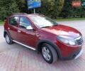 Красный Рено Сандеро, объемом двигателя 1.6 л и пробегом 221 тыс. км за 6200 $, фото 1 на Automoto.ua
