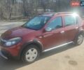 Червоний Рено Сандеро, об'ємом двигуна 1.6 л та пробігом 241 тис. км за 7000 $, фото 1 на Automoto.ua