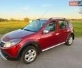 Красный Рено Сандеро, объемом двигателя 1.6 л и пробегом 153 тыс. км за 6900 $, фото 1 на Automoto.ua