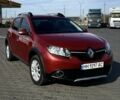 Красный Рено Сандеро, объемом двигателя 1.6 л и пробегом 84 тыс. км за 10900 $, фото 1 на Automoto.ua