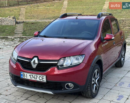 Красный Рено Сандеро, объемом двигателя 1.6 л и пробегом 88 тыс. км за 8799 $, фото 1 на Automoto.ua