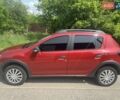 Красный Рено Сандеро, объемом двигателя 0.9 л и пробегом 125 тыс. км за 9300 $, фото 2 на Automoto.ua