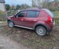 Красный Рено Сандеро, объемом двигателя 1.6 л и пробегом 97 тыс. км за 7000 $, фото 1 на Automoto.ua
