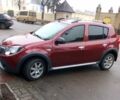 Червоний Рено Сандеро, об'ємом двигуна 1.6 л та пробігом 252 тис. км за 6500 $, фото 1 на Automoto.ua