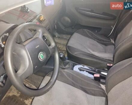 Белый Шкода Фабия, объемом двигателя 1.2 л и пробегом 260 тыс. км за 3650 $, фото 5 на Automoto.ua