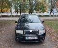 Черный Шкода Фабия, объемом двигателя 1.2 л и пробегом 234 тыс. км за 4200 $, фото 1 на Automoto.ua