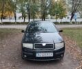 Черный Шкода Фабия, объемом двигателя 1.2 л и пробегом 234 тыс. км за 4200 $, фото 1 на Automoto.ua