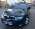 Черный Шкода Фабия, объемом двигателя 1.4 л и пробегом 203 тыс. км за 4100 $, фото 2 на Automoto.ua