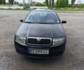 Черный Шкода Фабия, объемом двигателя 1.4 л и пробегом 304 тыс. км за 3500 $, фото 1 на Automoto.ua