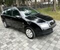 Черный Шкода Фабия, объемом двигателя 1.4 л и пробегом 230 тыс. км за 3999 $, фото 4 на Automoto.ua