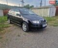 Черный Шкода Фабия, объемом двигателя 1.39 л и пробегом 200 тыс. км за 3900 $, фото 1 на Automoto.ua