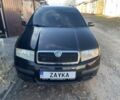 Черный Шкода Фабия, объемом двигателя 1.4 л и пробегом 328 тыс. км за 4500 $, фото 1 на Automoto.ua
