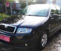 Черный Шкода Фабия, объемом двигателя 1.4 л и пробегом 219 тыс. км за 4699 $, фото 1 на Automoto.ua