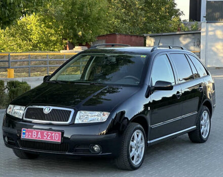 Черный Шкода Фабия, объемом двигателя 1.4 л и пробегом 230 тыс. км за 5200 $, фото 2 на Automoto.ua