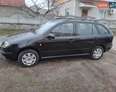 Черный Шкода Фабия, объемом двигателя 1.39 л и пробегом 151 тыс. км за 4500 $, фото 2 на Automoto.ua