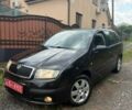 Черный Шкода Фабия, объемом двигателя 1.39 л и пробегом 220 тыс. км за 4449 $, фото 1 на Automoto.ua