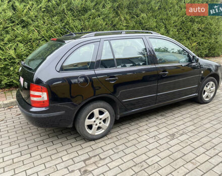 Черный Шкода Фабия, объемом двигателя 1.4 л и пробегом 246 тыс. км за 4399 $, фото 1 на Automoto.ua