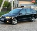 Черный Шкода Фабия, объемом двигателя 1.4 л и пробегом 128 тыс. км за 4600 $, фото 1 на Automoto.ua