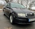 Черный Шкода Фабия, объемом двигателя 1.4 л и пробегом 179 тыс. км за 4700 $, фото 1 на Automoto.ua