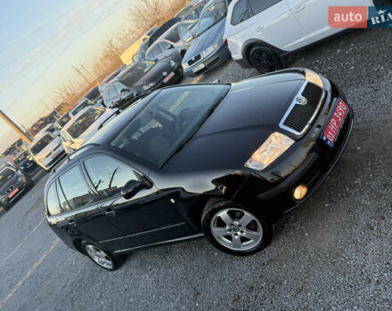 Черный Шкода Фабия, объемом двигателя 1.4 л и пробегом 200 тыс. км за 4999 $, фото 1 на Automoto.ua