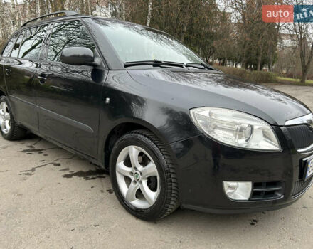 Черный Шкода Фабия, объемом двигателя 1.39 л и пробегом 202 тыс. км за 5750 $, фото 1 на Automoto.ua
