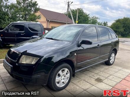 Черный Шкода Фабия, объемом двигателя 1.4 л и пробегом 186 тыс. км за 4100 $, фото 1 на Automoto.ua