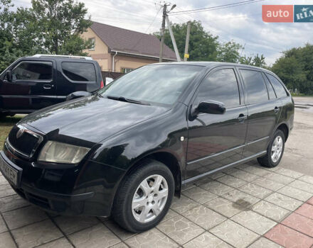 Черный Шкода Фабия, объемом двигателя 1.39 л и пробегом 186 тыс. км за 4100 $, фото 1 на Automoto.ua